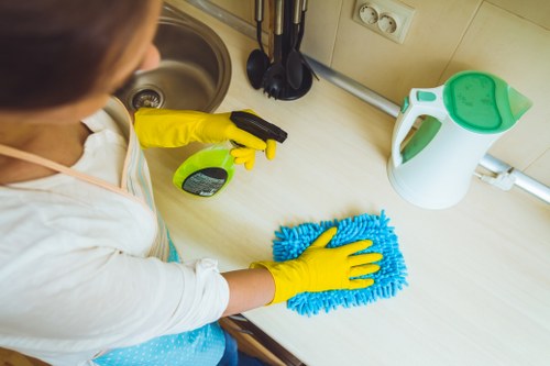 Bathroom surfaces being sanitized during move in cleaning
