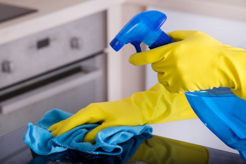 Professional commercial cleaning team maintaining a modern office lobby